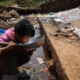 A child drinks water near a stream in Fuyuan county, Yunnan province March 20, 2009. World Water Day will be observed on March 22. Picture taken March 20, 2009. (Photo by Reuters/Stringer)